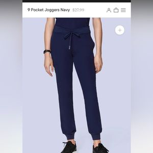 Mandala navy 9-pocket jogger scrub pants. Size small.